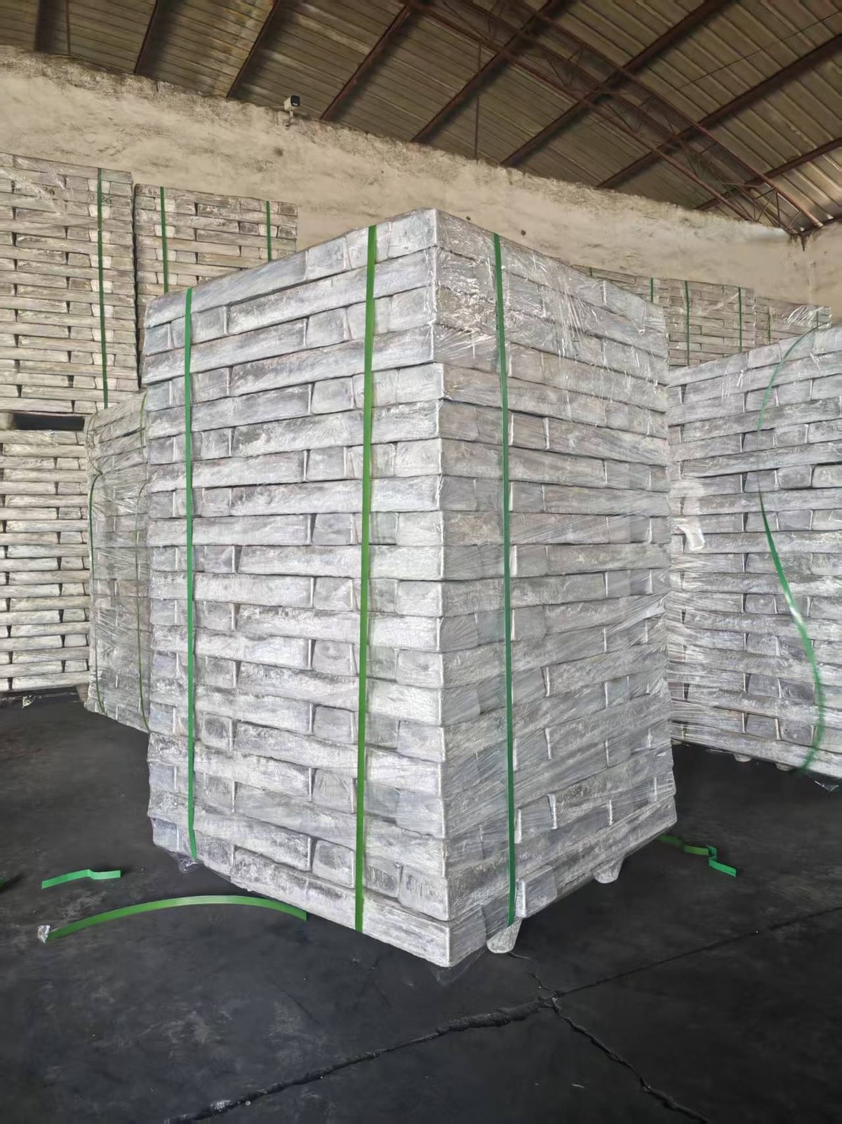 Magnesium ingots bundled on pallets in a storage warehouse
